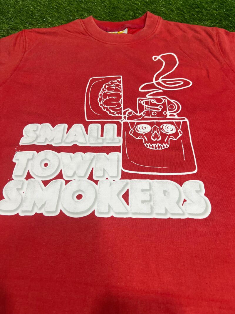 Small Town Smokers Tee in red with bold white graphic design